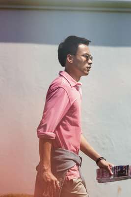 Sunglasses by Persol, polo shirt by Hackett, jumper (around waist) and shorts by Brioni, bracelet by Tod’s 