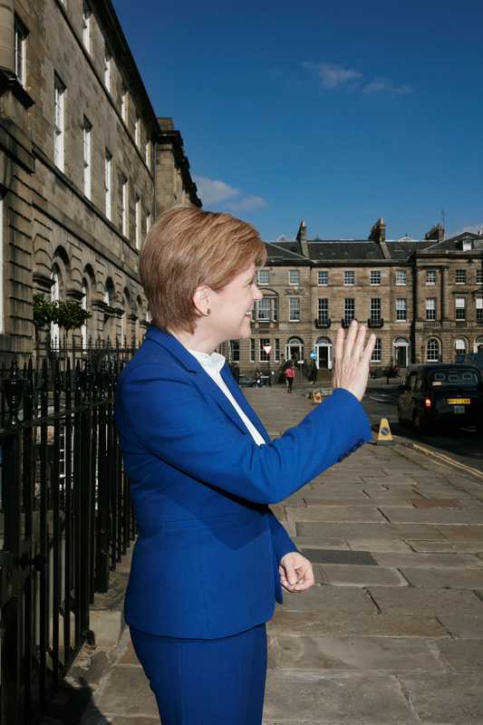 Saltire of the earth: the first minister  waving to admirers