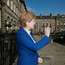 Saltire of the earth: the first minister  waving to admirers