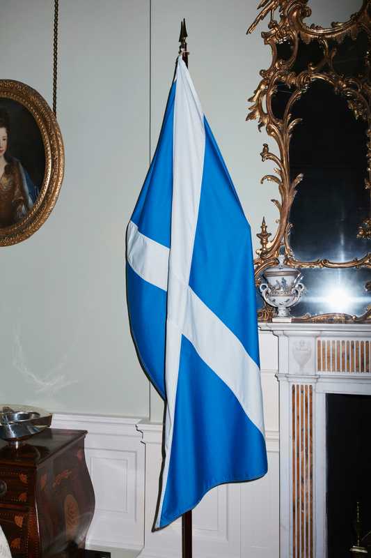 National flag adorning  a fireplace in the drawing room of Bute House