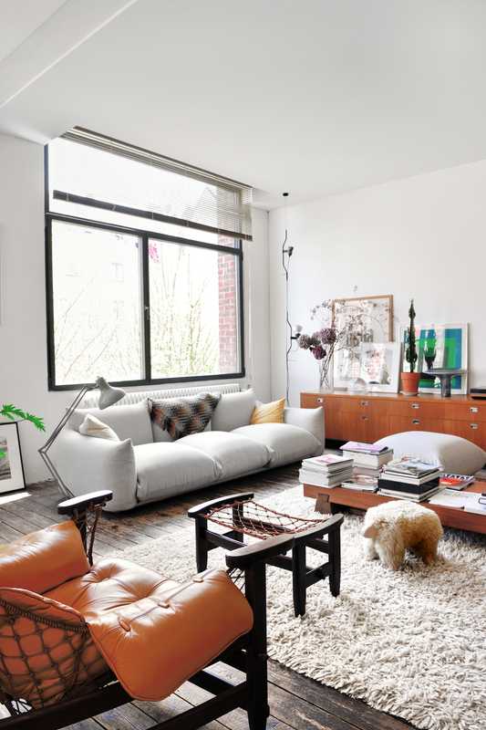 Inside the home of resident Pierre Lhoas. The sofa is by Arflex