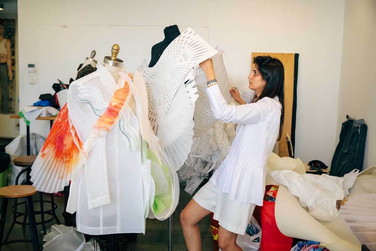 Student Shir Naeh working on her collection