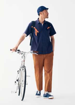 Shirt by Descente Pause, t-shirt by Acne Studios, trousers by Scye, trainers by Spalwart from Steven Alan, bike by Tokyobike, cap by Narifuri,  backpack by Finisterre