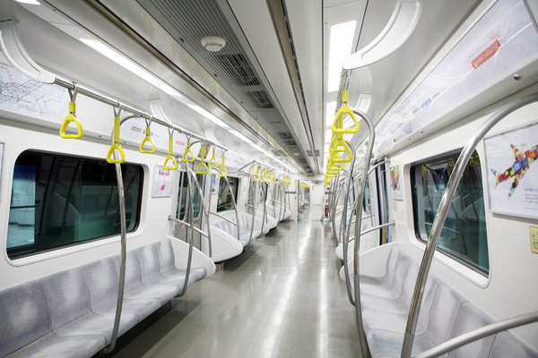 The interior of a subway car featuring Hyundai Capital ads