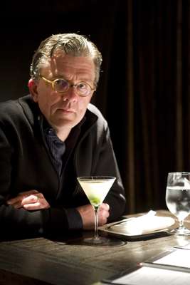 Andersen at his table with a gin gimlet