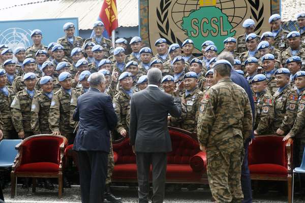 Former UN secretary-general Kofi Annan visits Mongolian 
troops in Sierra Leone
