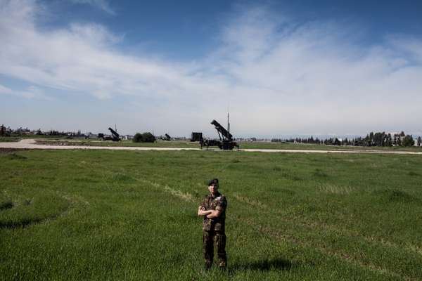 Dutch launch crew member in front of a Patriot battery