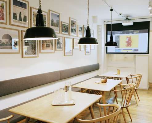 The downstairs with vintage Ercol chairs and tables from local store, Century