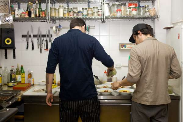 Chefs apply finishing touches in the kitchen
