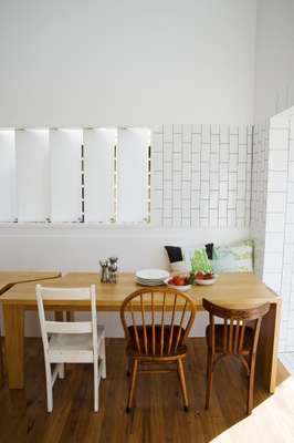 Dining room with a long bench built in to go with the specially made table