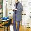 Coat by United Arrows, jacket and trousers by Prada,  jumper by Fedeli, shoes by JM Weston