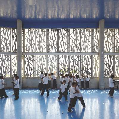 Concrete fretwork surrounds the school