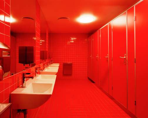 The girls’ loos are decorated in floor-to-ceiling red