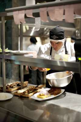 Chef prepares a Peruvian steak at Panchita, Acurio’s barbecue restaurant