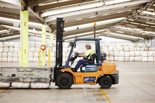An AWH forklift operator picks up wool bales at Yennora Wool Selling Centre 
