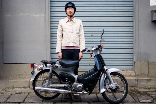 Hiroto Nishino, 24, works in a clothing shop and has been a scooter rider for three years, using it to get around town. He rides a Honda Super Cub