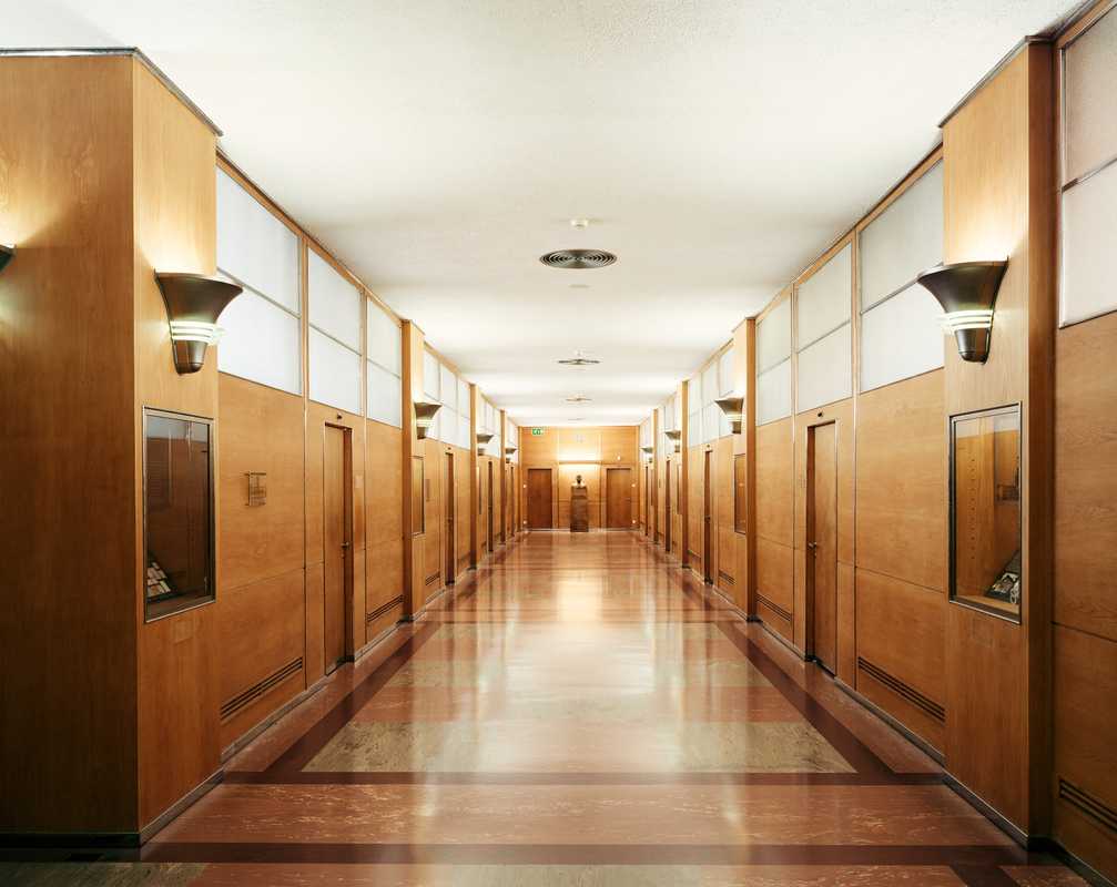 The eighth floor of Building 21 has been refurbished but retains original features such as linoleum flooring and wood-panelled walls
