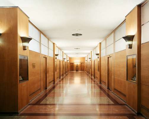 The eighth floor of Building 21 has been refurbished but retains original features such as linoleum flooring and wood-panelled walls