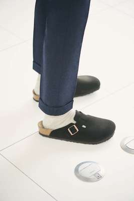 Trousers by Eleventy, socks by Uniqlo, clogs by Birkenstock