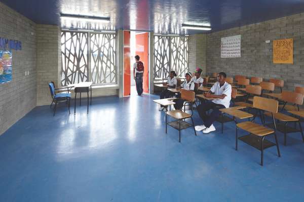 Classrooms are airy and light; they also use Colombian wooden furniture