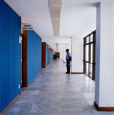 In the main annex each floor has wall panels in a different colour. The security guard does not always match the decor