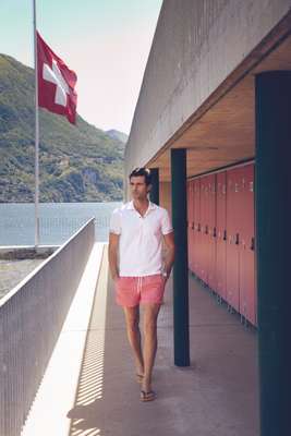 Polo shirt by Zegna Sport, swim trunks by Canali, flip flops by Havaianas, watch by Audemars Piguet
