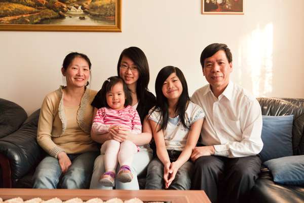 Nguyen Quoc Hung at home with his family