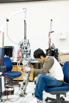 Student working on a humanoid robot prototype
