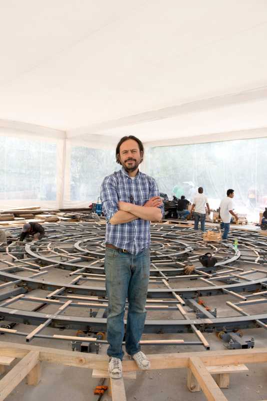 Mexican artist Damián Ortega in front of the soon-to-be-finished ‘Cosmogonía Doméstica’