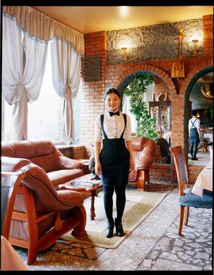 Waitress at the Italian Marco Polo restaurant, which houses an infamous strip club upstairs