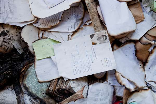 Personal files lie strewn on the floor of police station in La Goulette