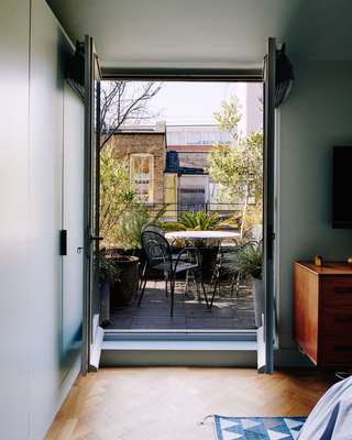 View from bedroom to small roof terrace
