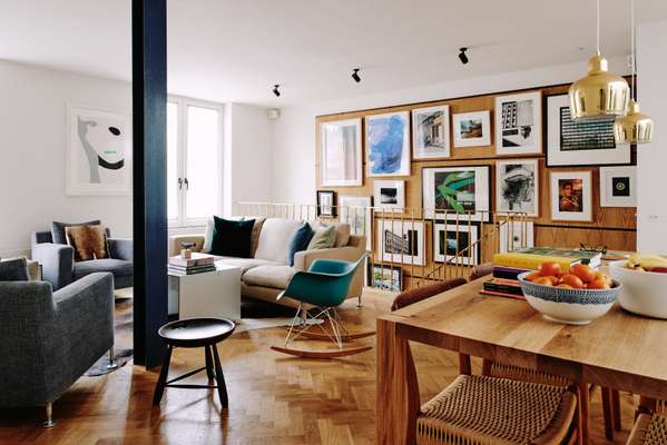 One of the key considerations was hanging the numerous pictures. Table by e15, Alvar Aalto lamps
