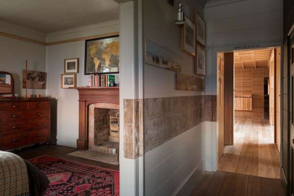 The central passage divides the original bedrooms 