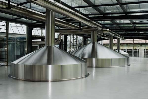 Stainless steel vats in Forst’s new brew house