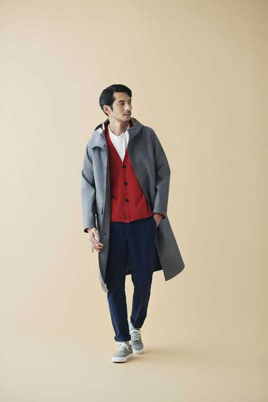 Coat by Mackintosh,  cardigan and trainers by Beauty  & Youth, t-shirt by Woolrich, trousers  by Colmar, socks by Muji