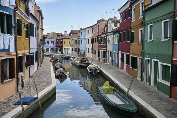 The canals of Murano are lined with  glassware shops