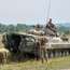 Ukrainian troops refill their vehicle while on a training mission