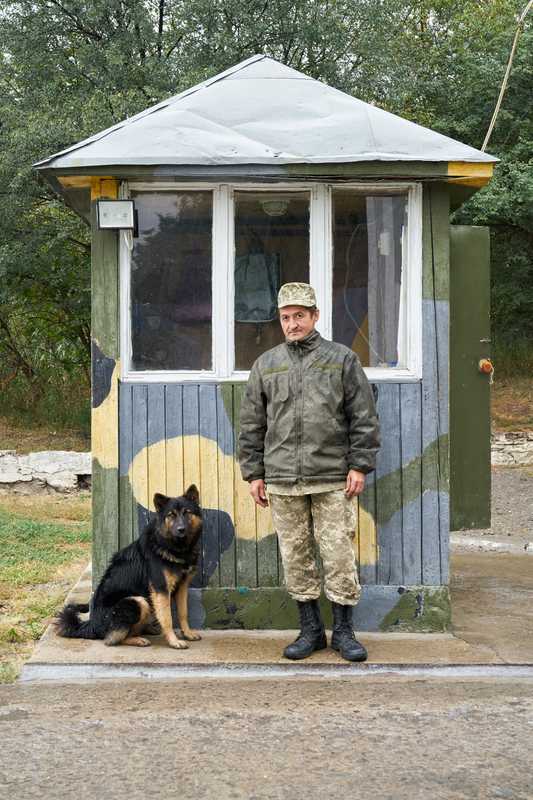 Ukrainian guard at the entrance of the centre in Kamianets-Podilskyi