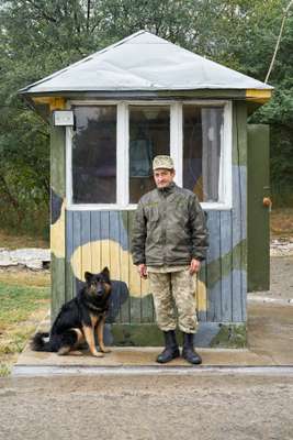 Ukrainian guard at the entrance of the centre in Kamianets-Podilskyi