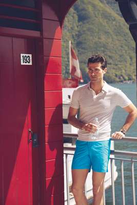 Polo shirt by Hermès, swim trunks by Orlebar Brown, watch by Bell & Ross