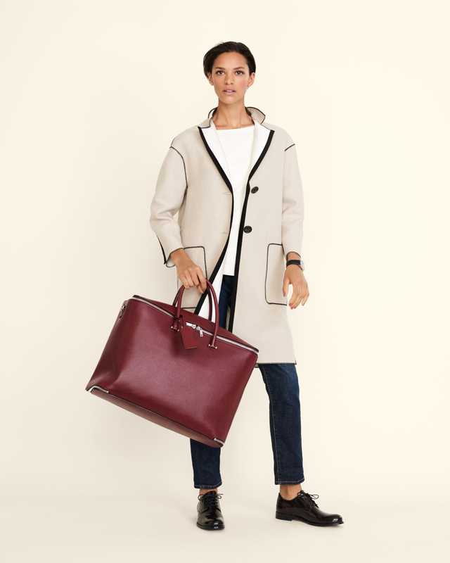 Coat by Agnona, pullover by Cos, jeans by Roy Roger’s, shoes by GH Bass & Co, watch by Hermès, bag by Valextra
