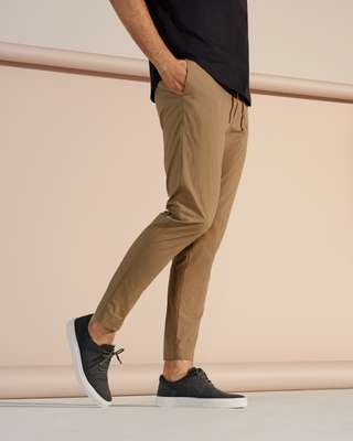 Short-sleeved pullover by Scye, trousers by Undecorated Man, trainers by AMB