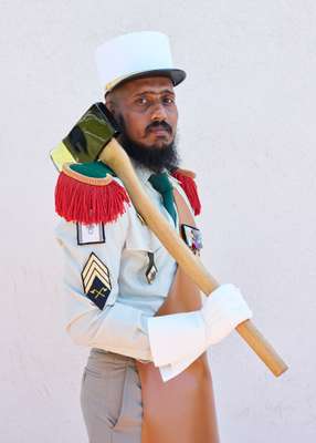 French Foreign Legion Pioneers march at the head of ceremonial parades with leather aprons and polished axes 