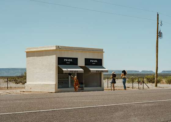 Austin girls pose at Elmgreen & Dragset’s Prada Marfa outside Valentine