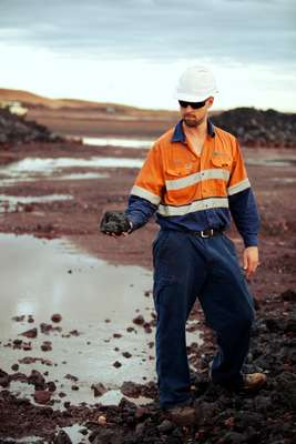 Worker holding manganese