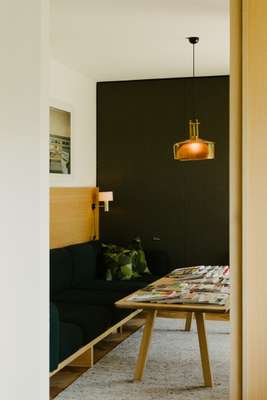 Harry Thaler was responsible for the built-in couch and table; the hanging lamp is vintage  from Hamburg 