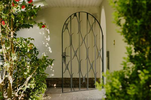 Original wrought-iron entrance gate 