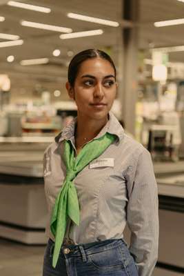 Cashier Eva Gomes in the  staff uniform