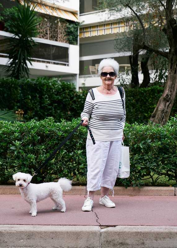 Resident taking her furry friend for a stroll